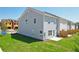 Townhouse exterior with a private backyard and neutral siding at 327 Crimson Dr, Union City, GA 30291