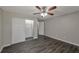 Bedroom with ceiling fan, mirrored closet doors, and gray walls at 1333 Womack Ave, Atlanta, GA 30344