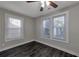 Well-lit bedroom featuring dark hardwood floors and ceiling fan at 1333 Womack Ave, Atlanta, GA 30344