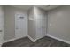 Bright entryway with wood-look floors, coat closet, and exterior door at 1333 Womack Ave, Atlanta, GA 30344