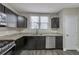 Newly renovated kitchen with granite countertops and dark cabinets at 1333 Womack Ave, Atlanta, GA 30344