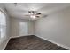 Living room featuring dark laminate flooring and ceiling fan at 1333 Womack Ave, Atlanta, GA 30344