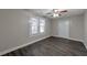 Spacious living area with dark floors and ceiling fan, access to backyard at 1333 Womack Ave, Atlanta, GA 30344
