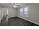 Bright living room with dark hardwood floors and ceiling fan at 1333 Womack Ave, Atlanta, GA 30344