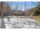 Brick home partially covered in snow with a yard at 323 Winding Stream Trl, Hampton, GA 30228