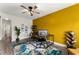 Spacious home office with wood desk and yellow accent wall at 6124 Locklear Way, Douglasville, GA 30134