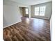 Bright living room featuring hardwood floors and large windows at 1825 Francis Dr, Conyers, GA 30094