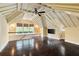 Bright attic space with hardwood floors, exposed ceiling beams, television and natural light at 2522 Habersham Nw Rd, Atlanta, GA 30305