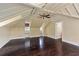 Finished attic space with hardwood floors, exposed ceiling beams and natural light at 2522 Habersham Nw Rd, Atlanta, GA 30305