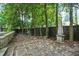 Backyard featuring stone tile flooring, an obelisk garden ornament and a surrounding wooden fence at 2522 Habersham Nw Rd, Atlanta, GA 30305