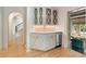 Elegant bar area with custom cabinetry, countertop, and a mini fridge at 2522 Habersham Nw Rd, Atlanta, GA 30305
