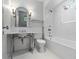 Elegant all-white bathroom featuring a pedestal sink, subway tile, and classic fixtures at 2522 Habersham Nw Rd, Atlanta, GA 30305
