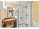 Bathroom featuring an ornate vanity, glass shower, and neutral wall color at 2522 Habersham Nw Rd, Atlanta, GA 30305