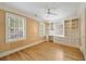 Bright room with hardwood floors, built-in desk area, and abundant natural light from two large windows at 2522 Habersham Nw Rd, Atlanta, GA 30305