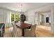 Well-lit dining room showcasing a wooden table, cabinet, and hardwood flooring at 2522 Habersham Nw Rd, Atlanta, GA 30305
