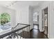 Bright hallway with dark hardwood floors and access to bedrooms and bathroom at 2522 Habersham Nw Rd, Atlanta, GA 30305