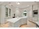 Spacious kitchen featuring a central island with a marble countertop and custom cabinetry at 2522 Habersham Nw Rd, Atlanta, GA 30305