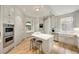 Spacious kitchen featuring custom cabinets, stainless steel appliances, and central island at 2522 Habersham Nw Rd, Atlanta, GA 30305