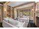 Elegant living room with fireplace, built-in shelves, and stylish neutral-toned furniture at 2522 Habersham Nw Rd, Atlanta, GA 30305
