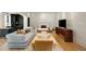Spacious living room featuring a fireplace, modern furniture, and a television at 2522 Habersham Nw Rd, Atlanta, GA 30305