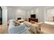 Inviting living room with modern decor, fireplace, and a view into a dining room at 2522 Habersham Nw Rd, Atlanta, GA 30305
