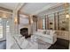 Elegant living room with fireplace, built-in shelves, and stylish neutral-toned furniture at 2522 Habersham Nw Rd, Atlanta, GA 30305