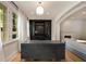 Well-lit office with a large desk, built-in shelving, and hardwood floors at 2522 Habersham Nw Rd, Atlanta, GA 30305