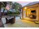 Outdoor patio with a dining area, outdoor kitchen and views of the pool and backyard at 2522 Habersham Nw Rd, Atlanta, GA 30305