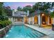 Backyard pool with a stone waterfall feature and a covered outdoor lounge area at 2522 Habersham Nw Rd, Atlanta, GA 30305