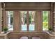 Bright room showing large windows with views of a pool and lush backyard at 2522 Habersham Nw Rd, Atlanta, GA 30305