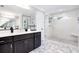 Modern bathroom with a large walk-in shower and double vanity at 510 Oak Dr, Hapeville, GA 30354