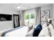 Modern bedroom with a large TV and full-length mirror at 510 Oak Dr, Hapeville, GA 30354