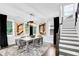 Bright dining room features a wood table, gray chairs, and stylish light fixture at 510 Oak Dr, Hapeville, GA 30354