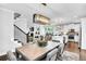 Bright dining room with a farmhouse table and view into the kitchen and living areas at 510 Oak Dr, Hapeville, GA 30354