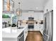 Modern kitchen features white cabinets, stainless steel appliances, and a large island at 510 Oak Dr, Hapeville, GA 30354