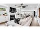 Open living space with sectional sofa, fireplace, and view of kitchen at 510 Oak Dr, Hapeville, GA 30354