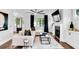 Spacious living room with hardwood floors, a fireplace, and large windows at 510 Oak Dr, Hapeville, GA 30354
