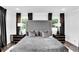Main bedroom with gray upholstered bed and plenty of natural light at 510 Oak Dr, Hapeville, GA 30354
