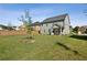 Spacious backyard with large grassy area and wooden fence at 13136 Vista Ln, Covington, GA 30014