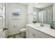 Clean bathroom with white vanity, toilet and shower/tub combo at 13136 Vista Ln, Covington, GA 30014