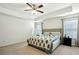 Spacious bedroom with king-size bed and ceiling fan at 13136 Vista Ln, Covington, GA 30014
