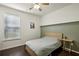 Bright bedroom with wood floors and ceiling fan at 13136 Vista Ln, Covington, GA 30014