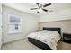Spacious bedroom with ceiling fan and carpet flooring at 13136 Vista Ln, Covington, GA 30014