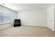 Spacious bonus room with plush recliner and window at 13136 Vista Ln, Covington, GA 30014