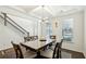 Bright dining room with hardwood floors and a six-person table at 13136 Vista Ln, Covington, GA 30014