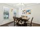 Dining room with hardwood floors and a large table for six at 13136 Vista Ln, Covington, GA 30014