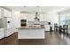 Modern kitchen with white cabinets, granite island, and stainless steel appliances at 13136 Vista Ln, Covington, GA 30014