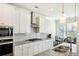 Modern kitchen with stainless steel appliances and granite countertops at 13136 Vista Ln, Covington, GA 30014