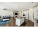 Open floor plan with kitchen island and living room at 13136 Vista Ln, Covington, GA 30014