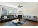 Spacious living room with fireplace, hardwood floors and comfy sofas at 13136 Vista Ln, Covington, GA 30014